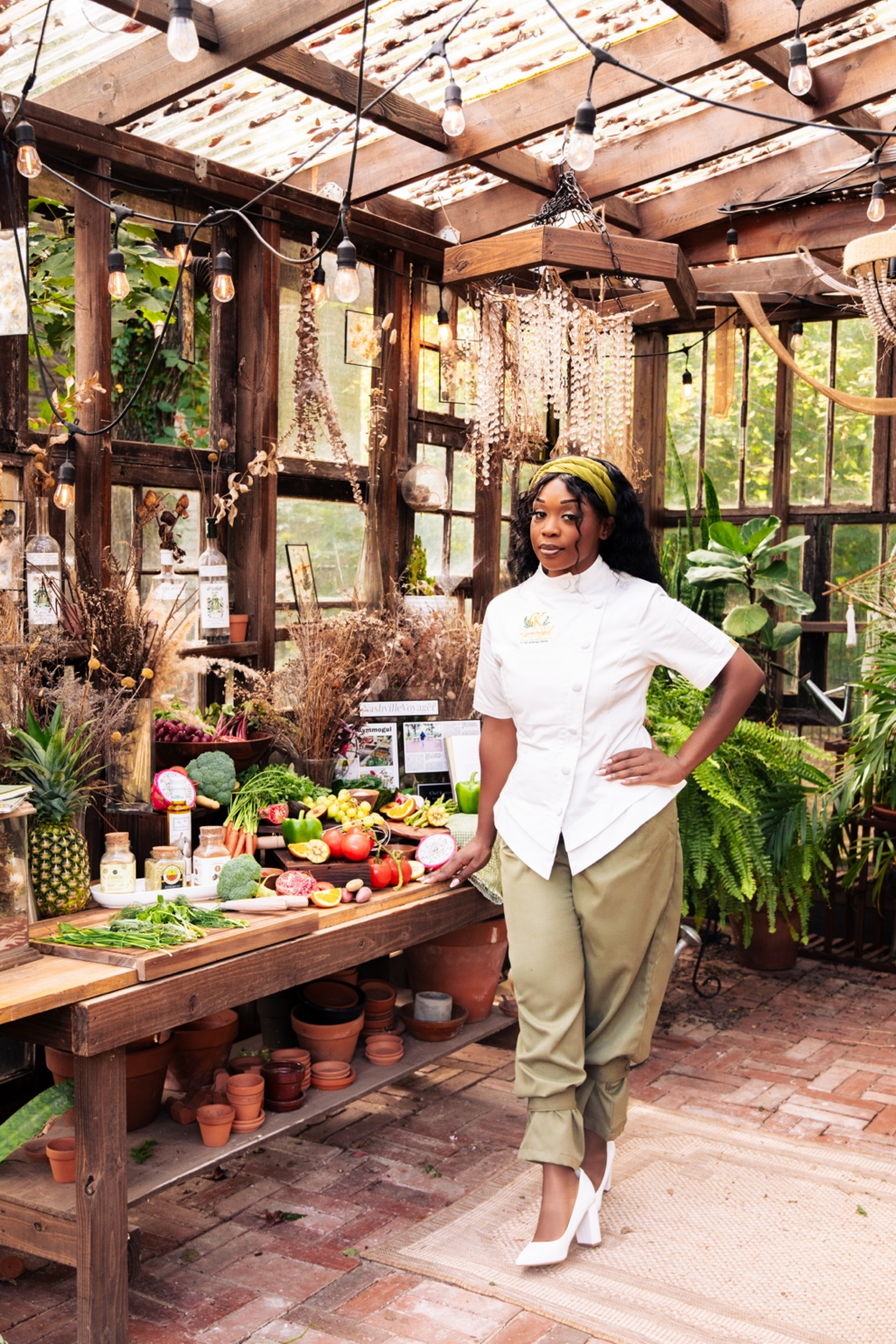 Chef Kymmogul holding a bowl of fresh produce